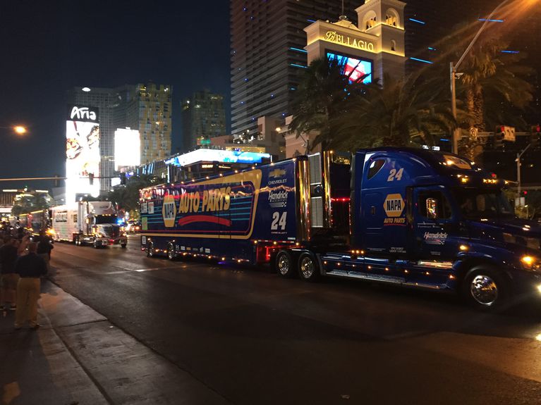 NASCAR hauler parade greeted by rowdy fans on Las Vegas strip